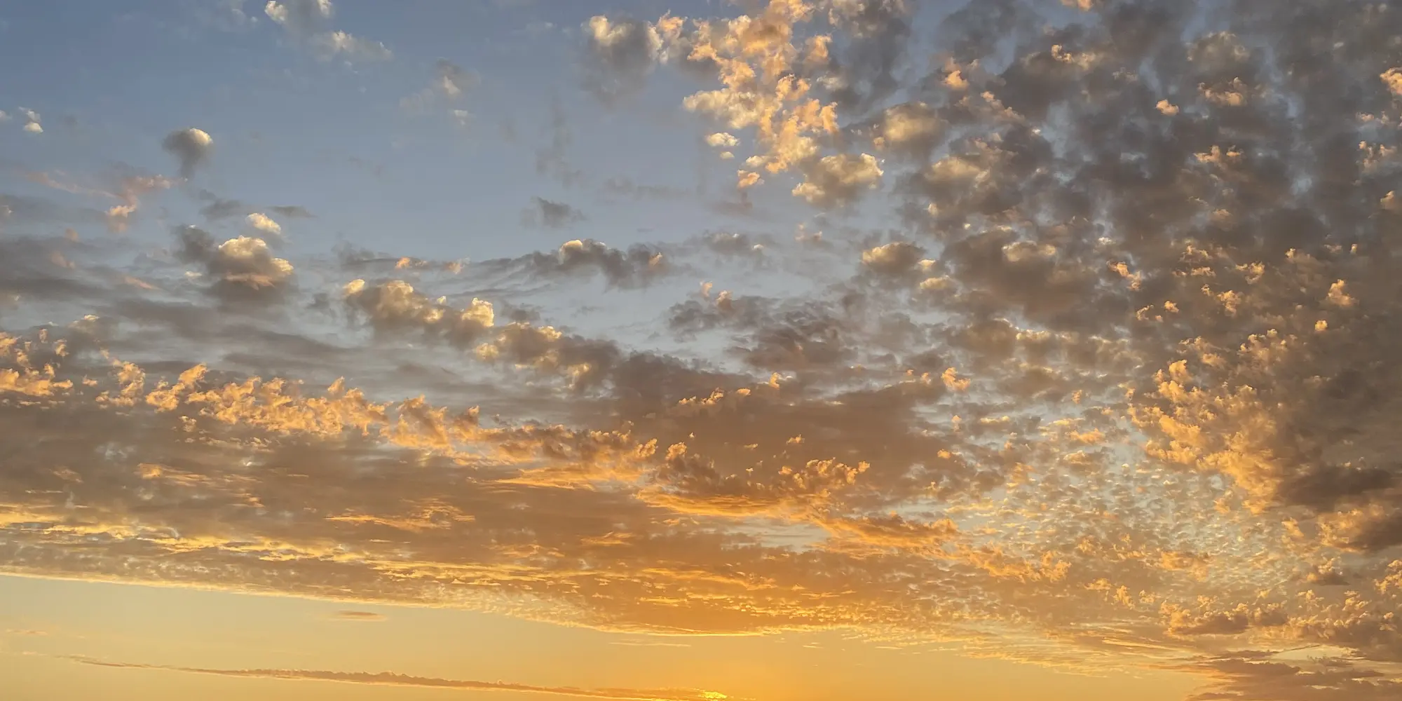 A golden sky over the ocean at first light