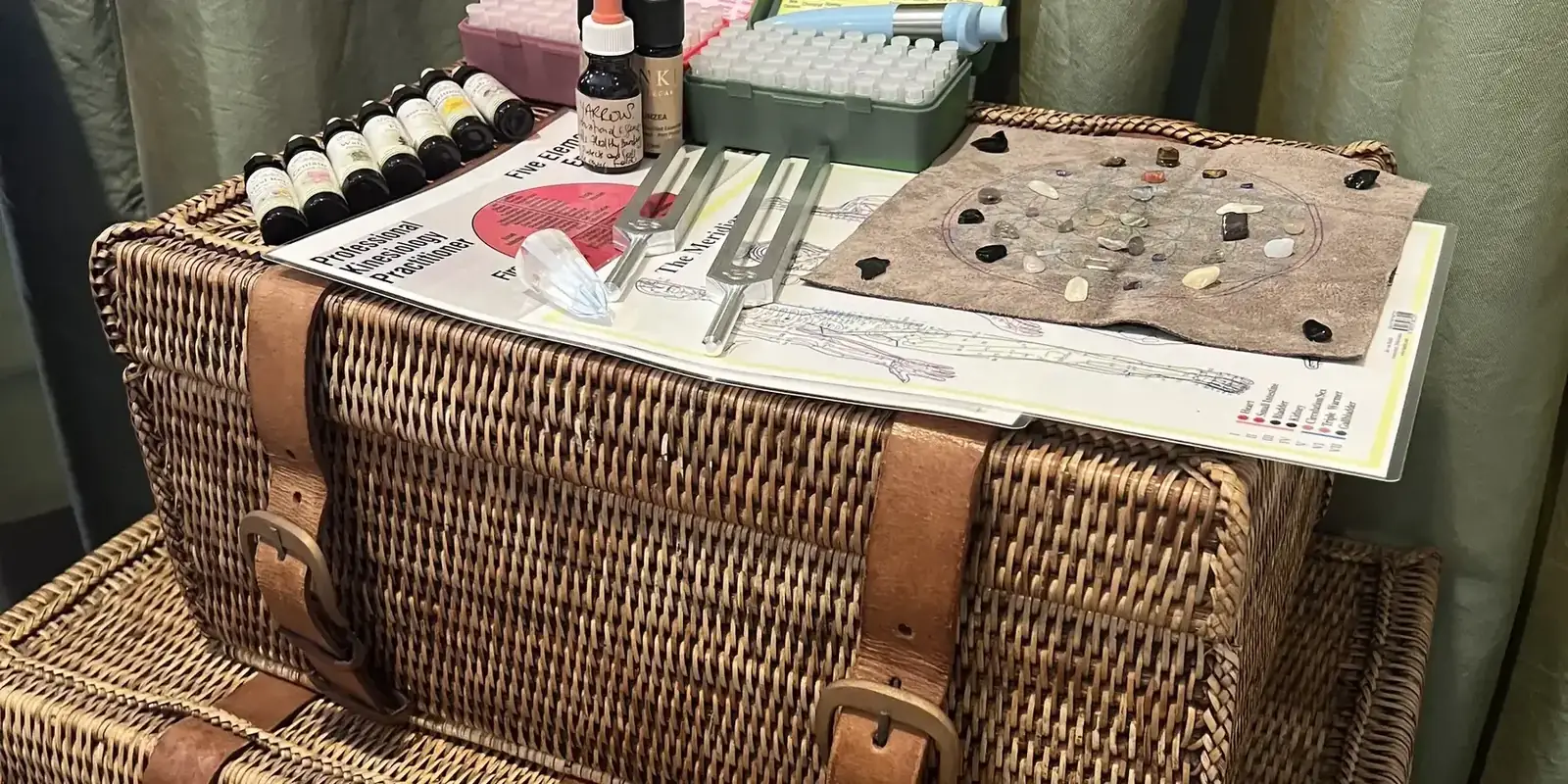 Kinesiology tools, tuning forks and remedy bottles on Phil's desk