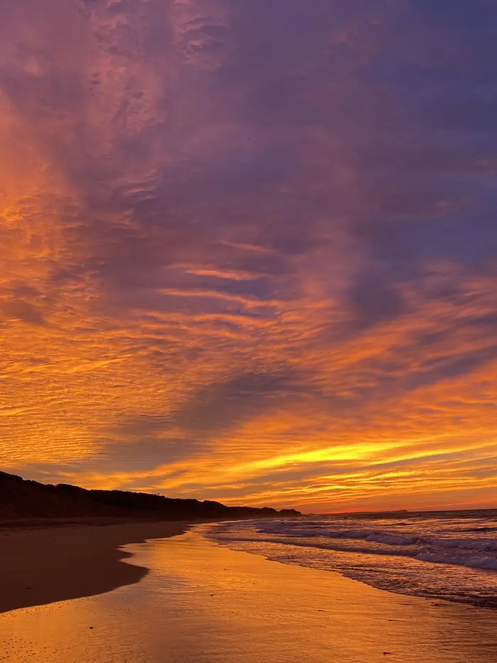 Violet and orange dawn sky over the Surf Coast shoreline